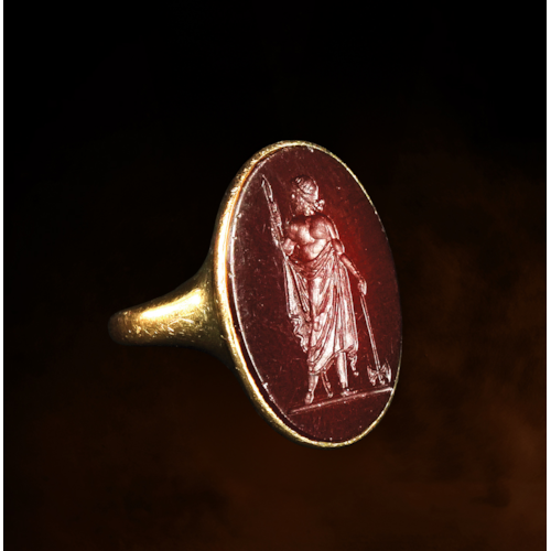 A Neoclassical carnelian intaglio set in an 18k gold ring. Zeus Labraundos, after the Hekatomnid coinage of Halikarnassos.